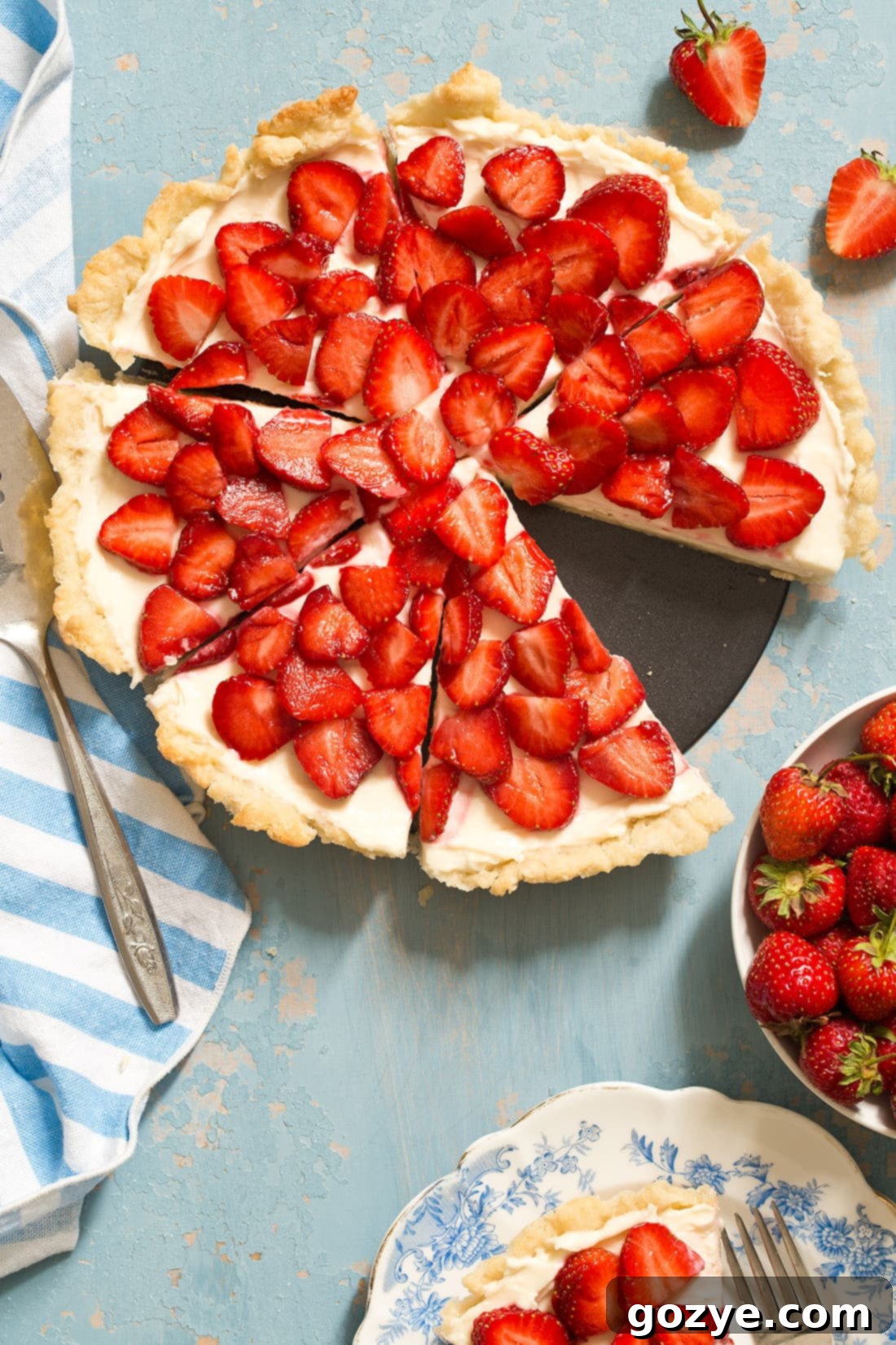 Strawberry Cream Cheese Tart with a homemade pie crust is an easy summer tart that will impress. It's like eating a strawberry pie and cheesecake in one bite.