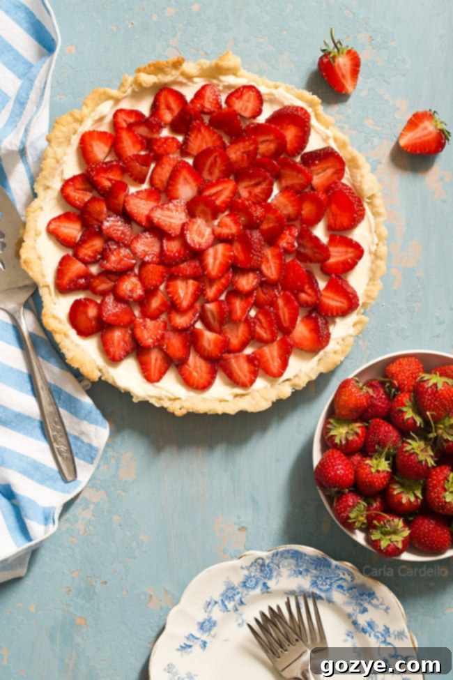 Strawberry Cream Cheese Tart with a homemade pie crust is an easy summer tart that will impress. It's like eating a strawberry pie and cheesecake in one bite. 