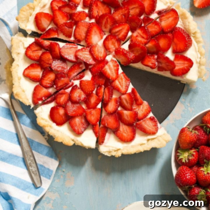 Strawberries and Cream Tart, featuring fresh strawberries and a creamy filling.