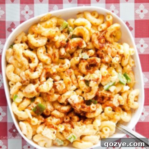 Amish Farmhouse Macaroni Salad 10 Amish Macaroni Salad in white bowl on red checkered background