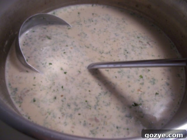 A comforting bowl of homemade wild mushroom soup, garnished with fresh parsley, ready to be enjoyed.