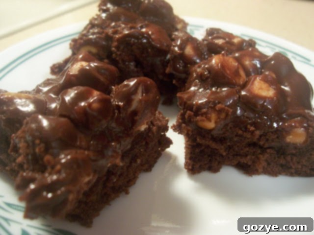 Delicious Rocky Road Brownies cooling on a wire rack, showing their gooey topping.