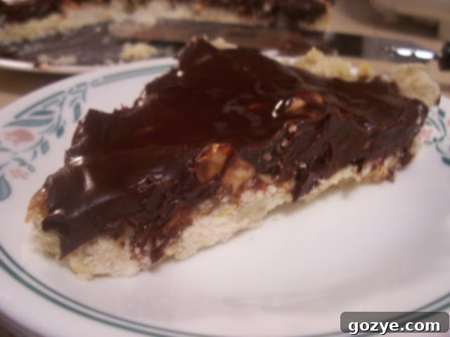 The first attempt at Dorie's Chocolate-Crunched Caramel Tart, showing the full tart in an 11-inch pan with slightly uneven caramel distribution.