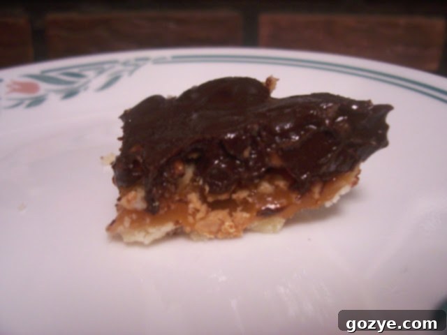 Several mini Chocolate-Crunched Caramel Tarts in small individual tart pans, showcasing the challenges with crust shrinkage.