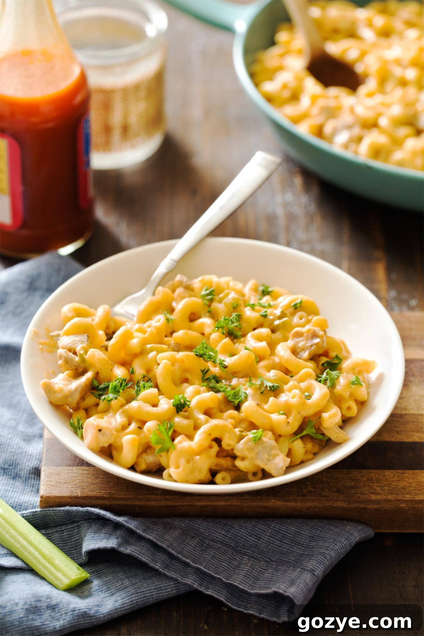 Buffalo mac and cheese in a bowl with fork