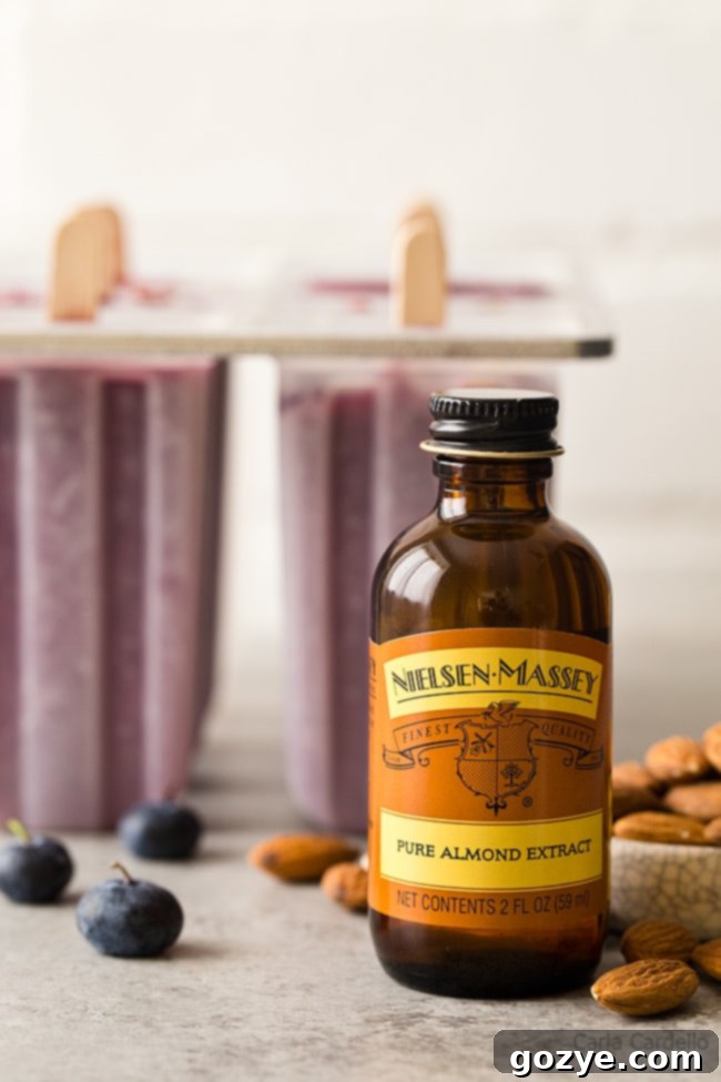 Nielsen-Massey Pure Almond Extract, the secret ingredient for enhanced blueberry popsicle flavor.