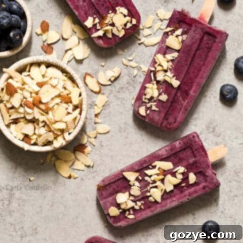 Finished Blueberry Yogurt Popsicles with almonds, ready to enjoy.