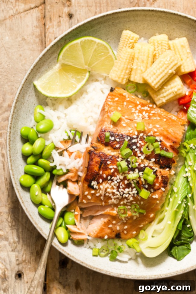 Asian salmon in bowl with rice and vegetables