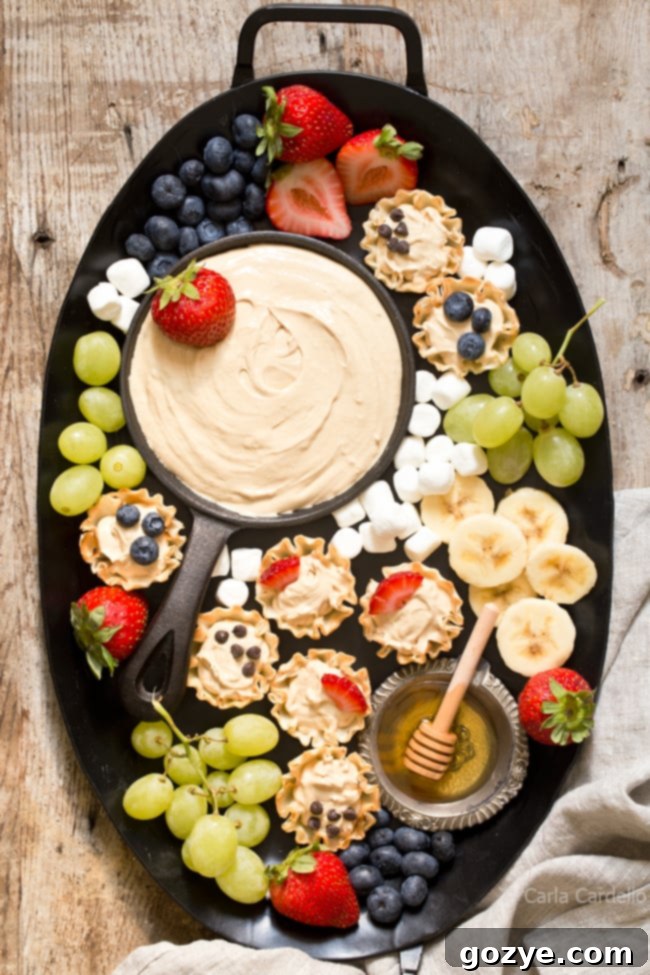 Make snack time more exciting with no bake mini Peanut Butter Fruit Dip Phyllo Cups made with marshmallow creme and Greek yogurt.