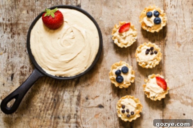 Make snack time more exciting with no bake mini Peanut Butter Fruit Dip Phyllo Cups made with marshmallow creme and Greek yogurt.