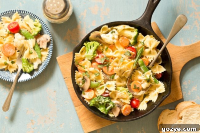 Close-up of One Pan Pasta Primavera with creamy sauce and colorful vegetables, showcasing the delicious texture.