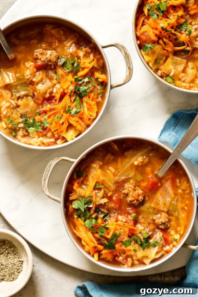 Stuffed Cabbage Soup with ground beef, rice, tomatoes, and cabbage in a comforting broth, served in a bowl. Ideal for those who love cabbage rolls but seek an easier, one-pot preparation method.