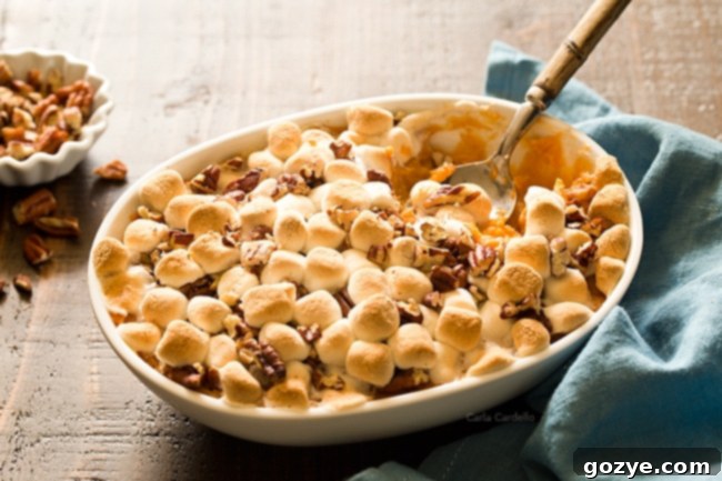 Dreamy Sweet Potato Casserole For Two 4 Close-up of Sweet Potato Casserole For Two, showing the fluffy marshmallows and pecans.