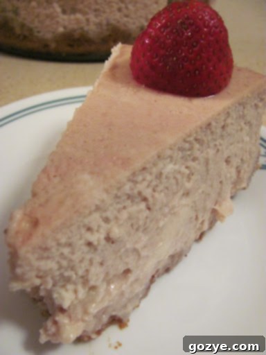 Strawberry White Chocolate Chip Cheesecake with fresh berries on top