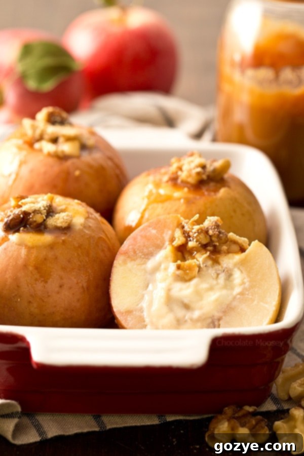 Cheesecake Stuffed Apples with walnuts and caramel sauce.