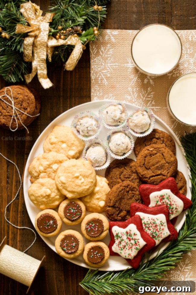 A festive Christmas cookie tray filled with a variety of holiday cookies, including snowball cookies, gingersnaps, and peanut butter cups.