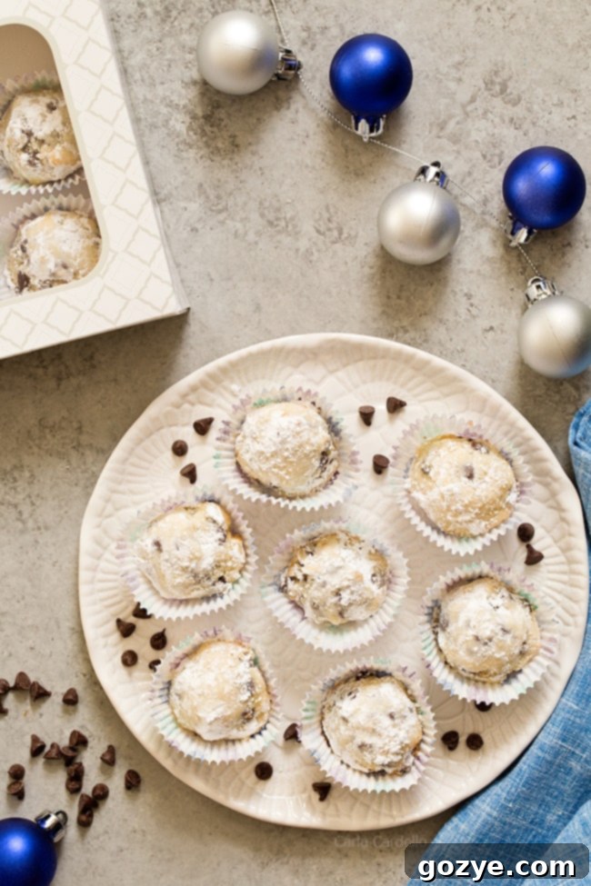 Chocolate Chip Snowball Cookies on a white plate, showcasing their snowy appearance and small size
