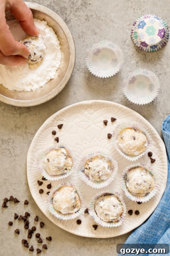 Step-by-step image of rolling snowball cookie dough in powdered sugar