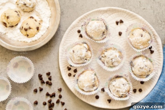 Chocolate Chip Snowball Cookies arranged neatly on a white plate, ready to be served