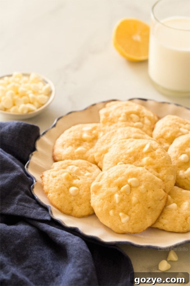 Add some brightness to your cookie tray with soft Lemon White Chocolate Chip Cookies! Recipe makes 1 dozen cookies with a punch of lemon and white chocolate. 