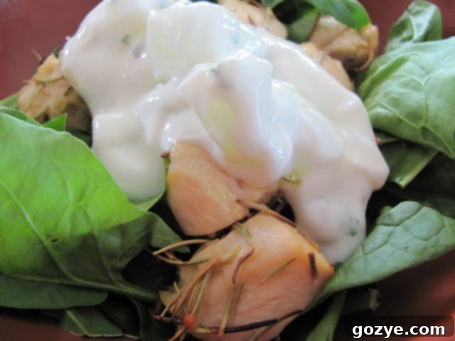 Close-up of marinated chicken pieces threaded onto skewers, ready for grilling or broiling.