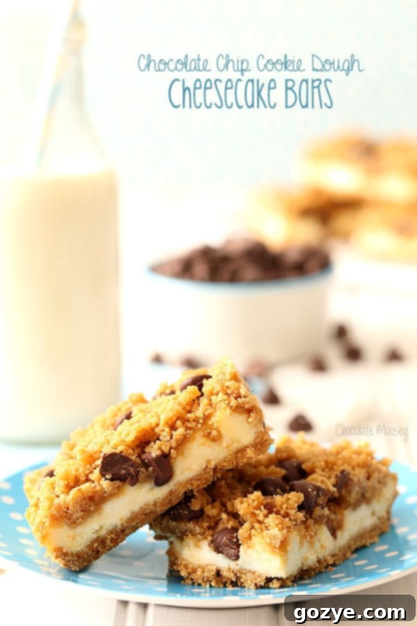 Close-up of a perfectly cut Chocolate Chip Cookie Dough Cheesecake Bar, showcasing the distinct layers of crunchy crust, creamy cheesecake, and chunky cookie dough topping, ready to be enjoyed.