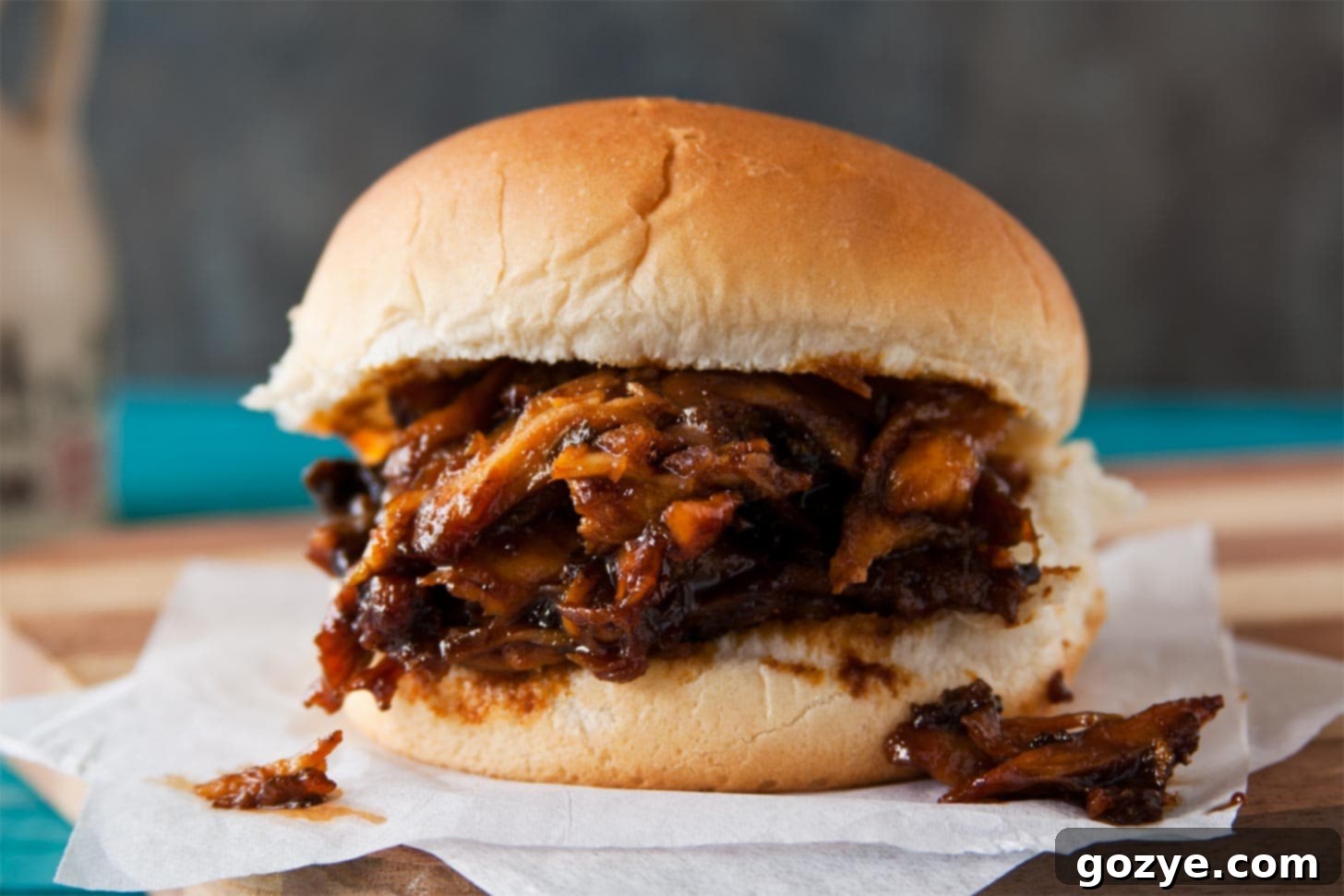 Set-It-and-Forget-It BBQ Pulled Chicken 4 Slow cooker barbecue chicken served as a sandwich