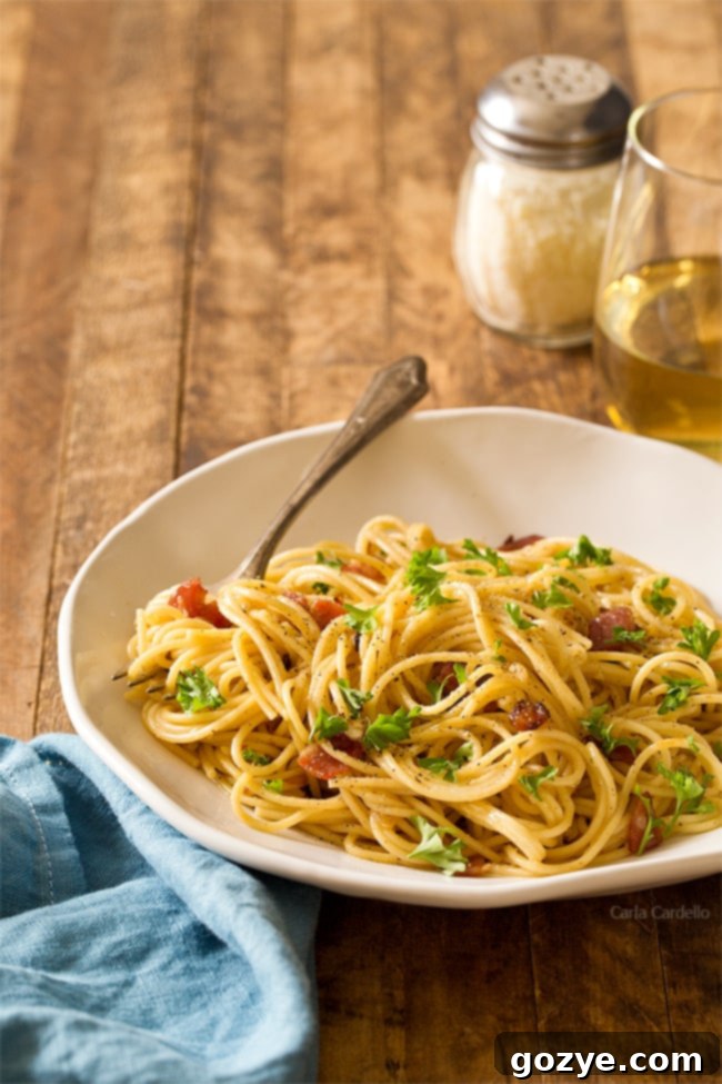 Easy & Romantic Spaghetti Carbonara for Two, served with white wine and dessert for a perfect stay-in date night.