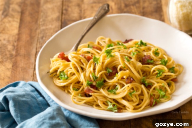 Spaghetti Carbonara Dinner For Two with bacon, cheese, and egg, beautifully presented for a romantic meal at home.