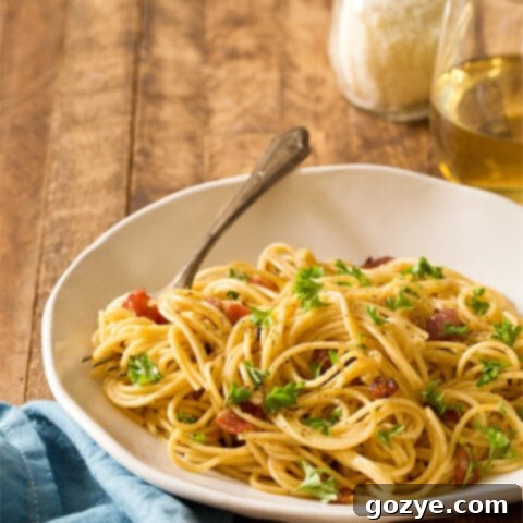 Easy & Romantic Spaghetti Carbonara for Two with bacon and cheese for a perfect date night dinner.