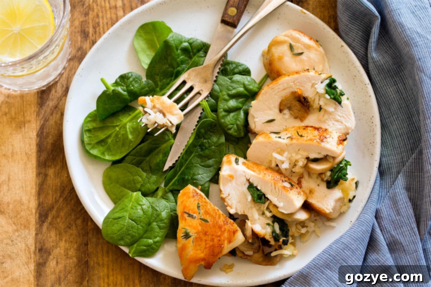 Rice Stuffed Chicken sliced on a plate with salad