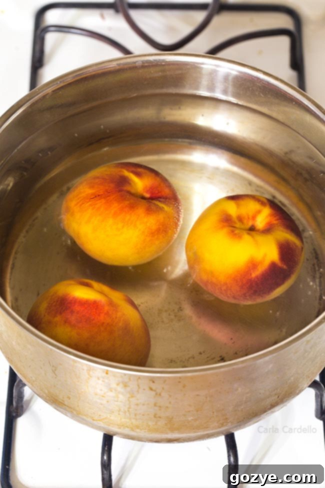 Large pot of water with peaches