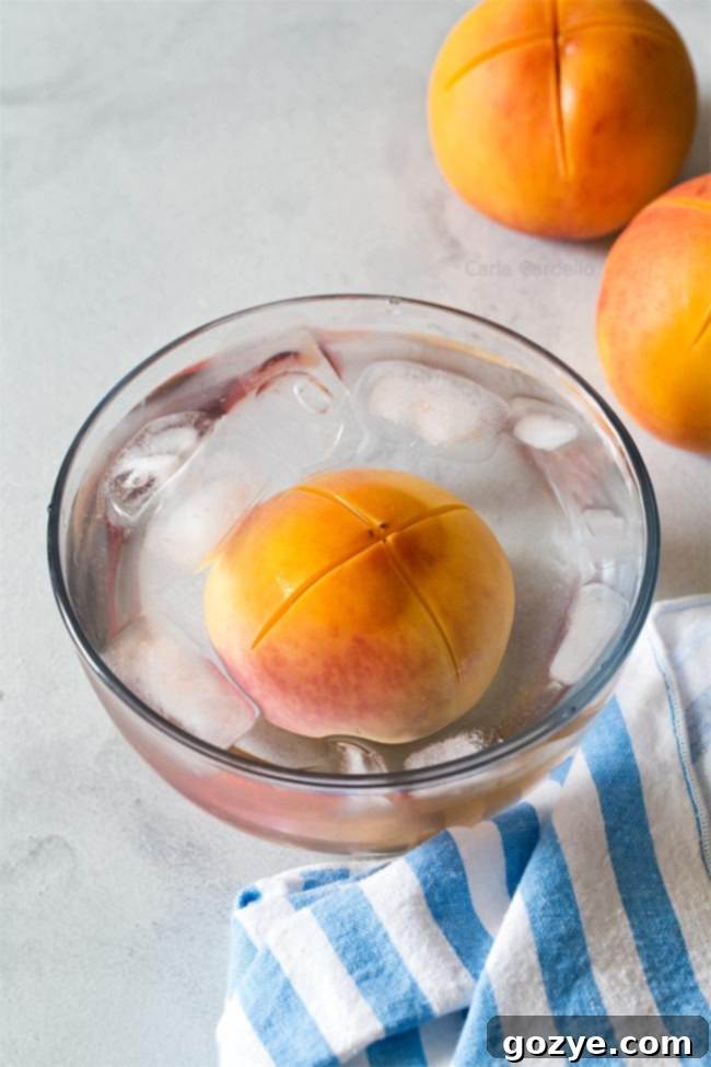 Peach in bowl of ice water