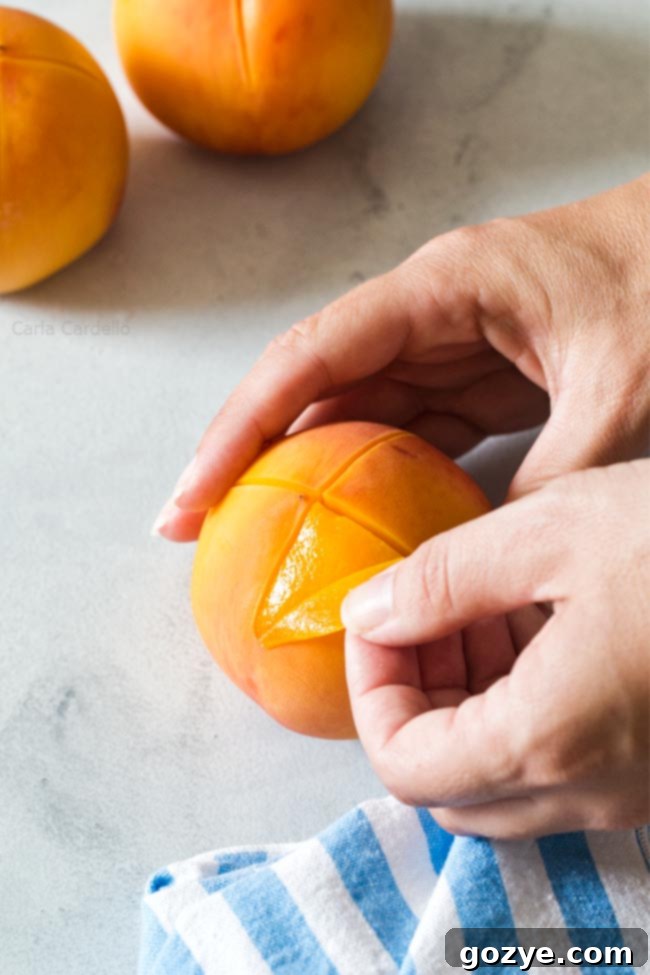 Peeling a peach with hands