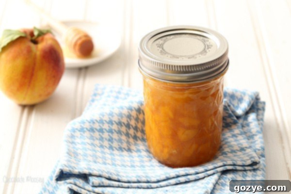Peach Jam without pectin in a jar on a linen