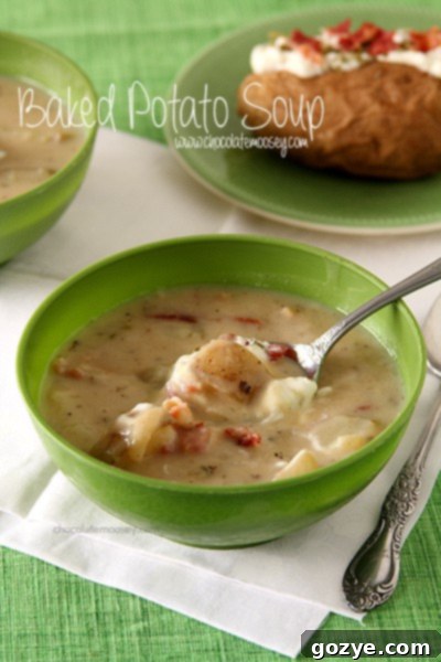 Baked Potato Soup with crispy bacon, a quick and easy recipe that doesn't require pre-baking potatoes. Served with fresh chives.