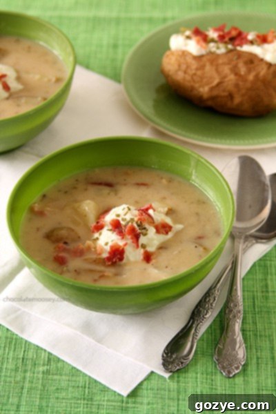 Cubed Russet potatoes simmering in a rich, creamy broth for a quick baked potato soup. The skins are left on for added texture and nutrients.