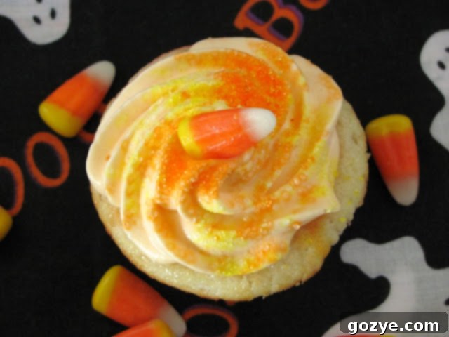 Yellow and orange cupcake batter in bowls