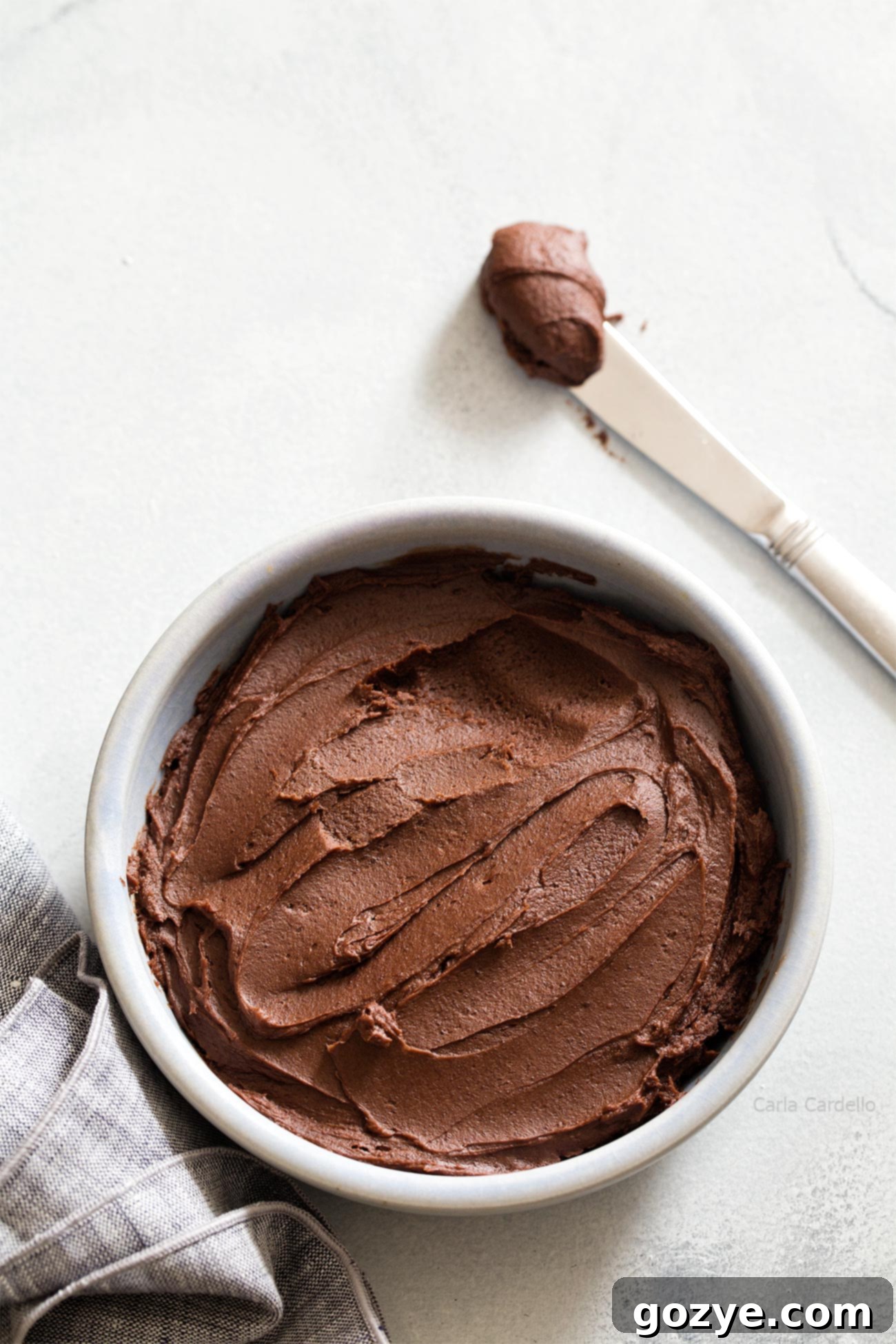 Small Batch Chocolate Frosting generously piped onto 6 cupcakes, demonstrating perfect yield