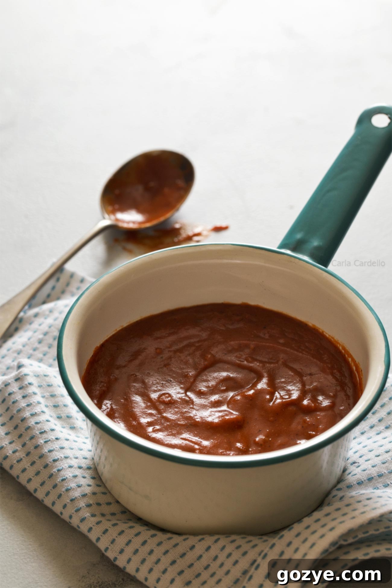 Step-by-step image showing how to combine flour and fajita seasoning for homemade enchilada sauce