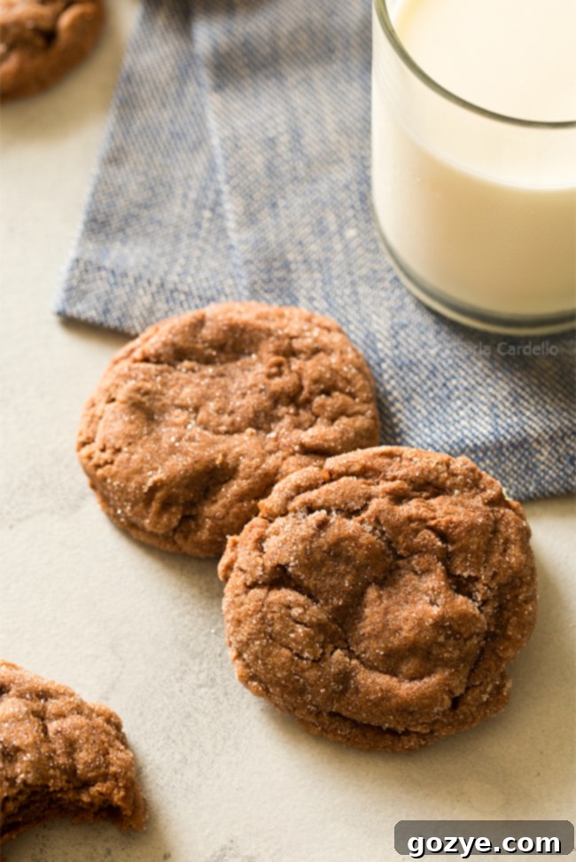 Close-up of baked Peanut Butter Nutella Crinkle Cookies, showcasing their soft, moist interior and beautifully cracked sugary exterior. A perfect indulgence for cookie lovers.