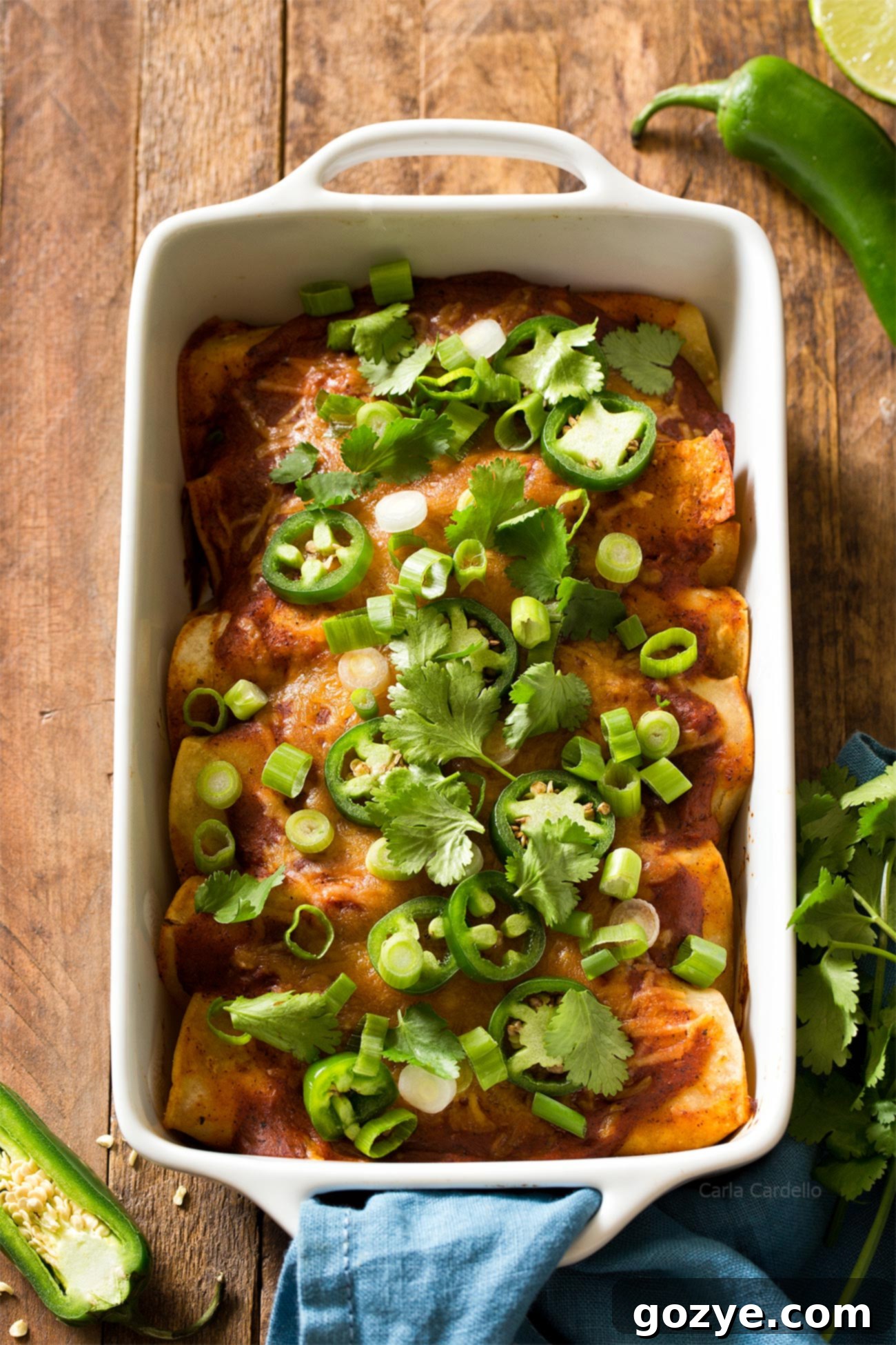 Beef Enchiladas in white casserole dish