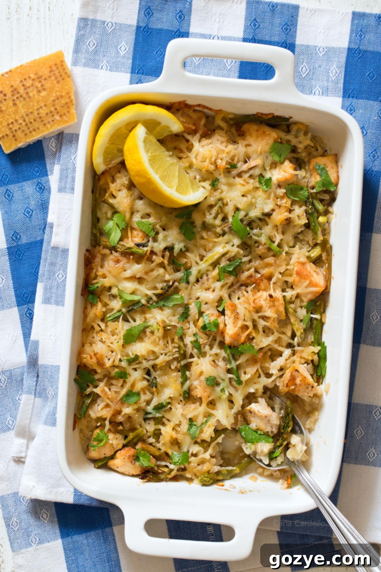 Parmesan Chicken and Rice in white casserole dish
