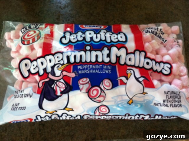 Cool Peppermint Crunch Bars 3 Melted peppermint marshmallows and crispy rice cereal being mixed in a bowl