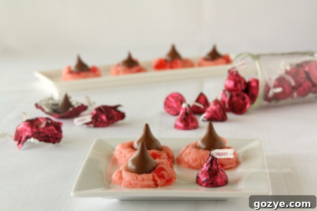 Two perfect Cherry Cordial Blossom Cookies on a cooling rack