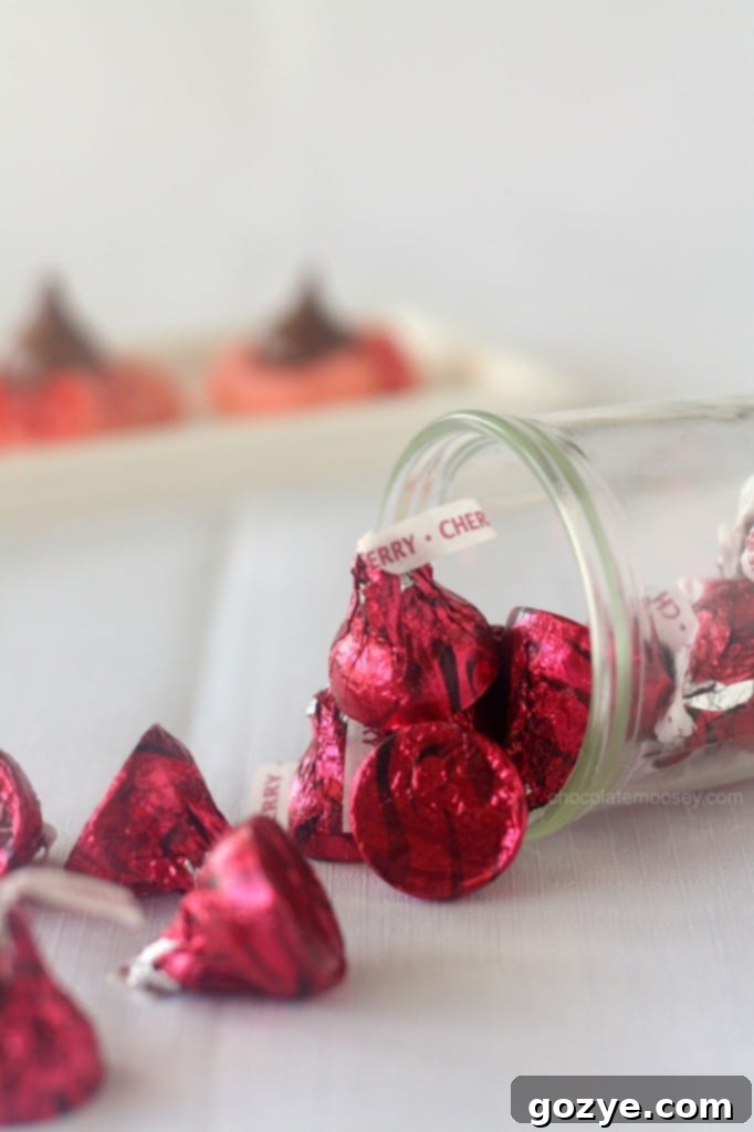 A close-up view of the rich, red cookie base and melting chocolate kiss