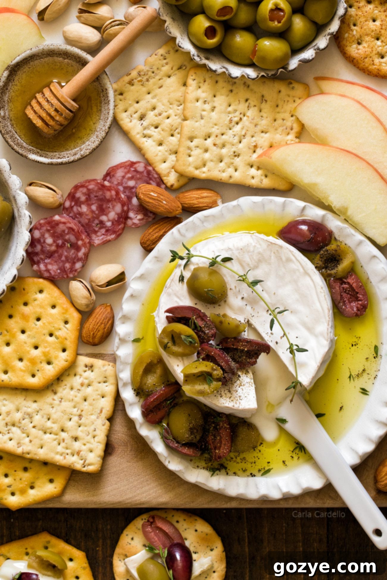 Melty Olive & Brie Delight 2 Olive Baked Brie with Thyme and Olive Oil - A delicious appetizer