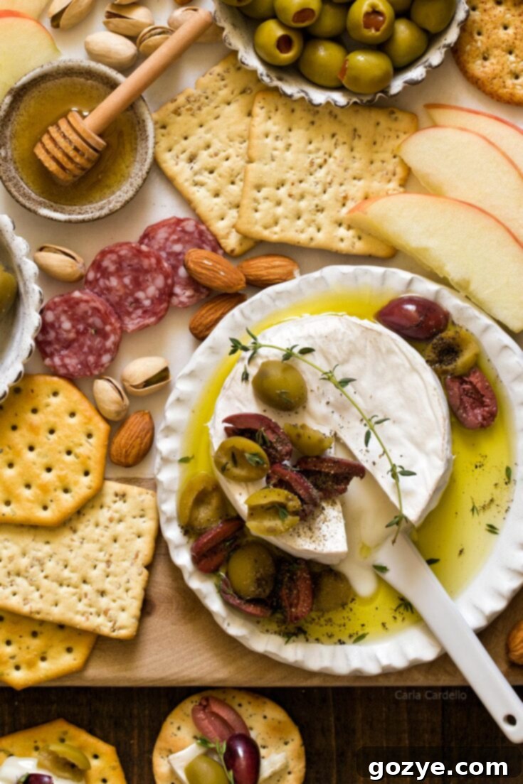 Pin this delicious Olive Baked Brie recipe