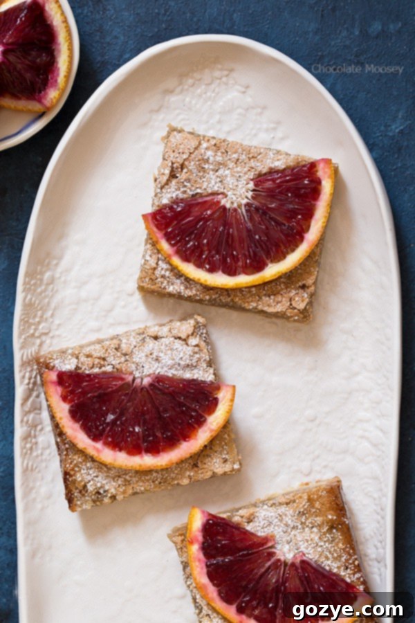 A selection of baked goods including blood orange bars, emphasizing their delicious appeal.