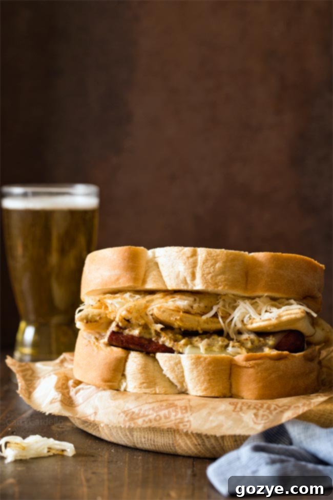 The Polish Hill Pierogy Sandwich: A quintessential Pittsburgh dish with kielbasa, pierogies, coleslaw, and beer mustard, embodying the city's unique culinary fusion.